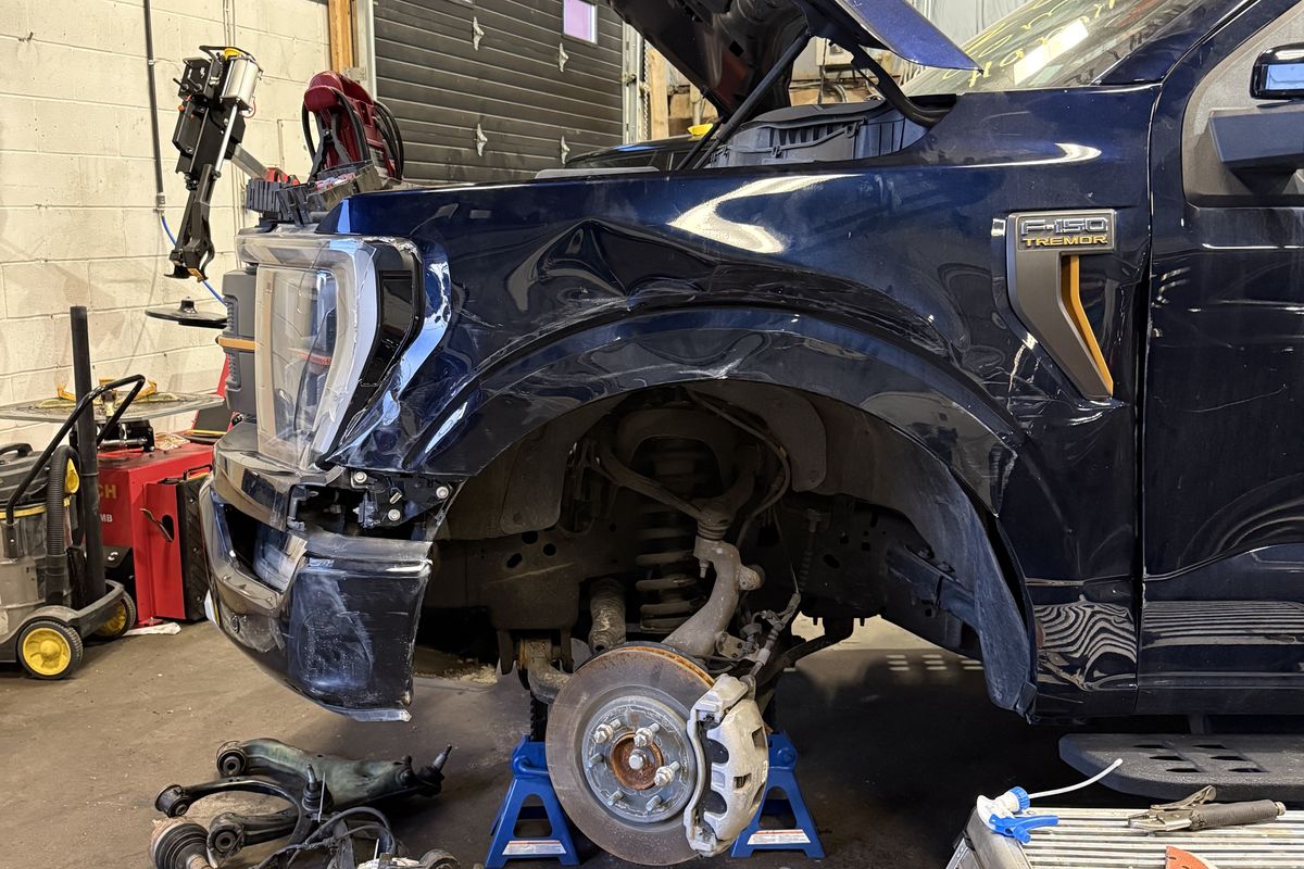 Ford F-150 with brake rotor and coilover suspension parts removed